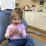 Young girl in dental chair