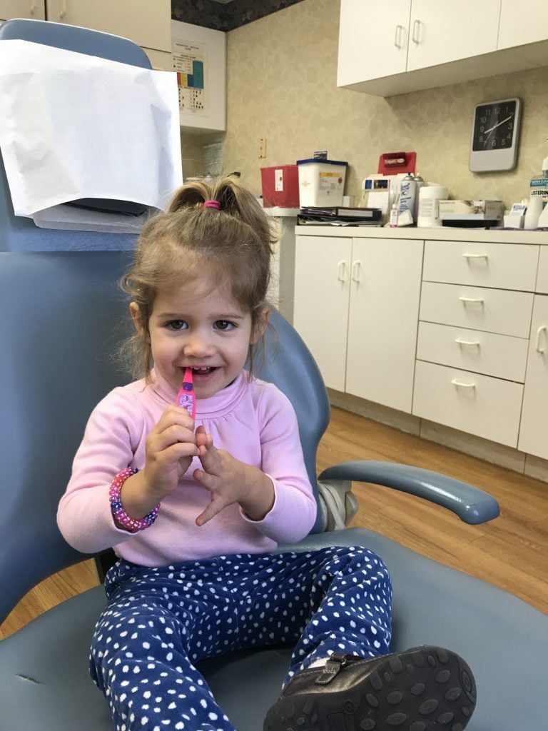 Young girl in dental chair