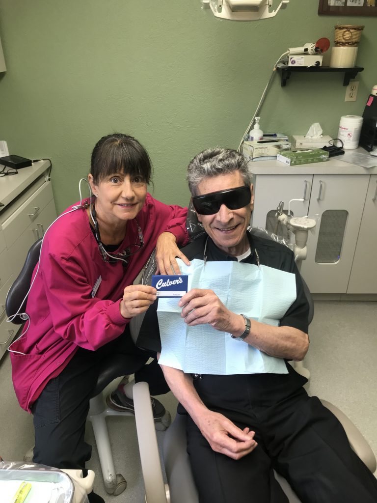 Dental hygienist with patient
